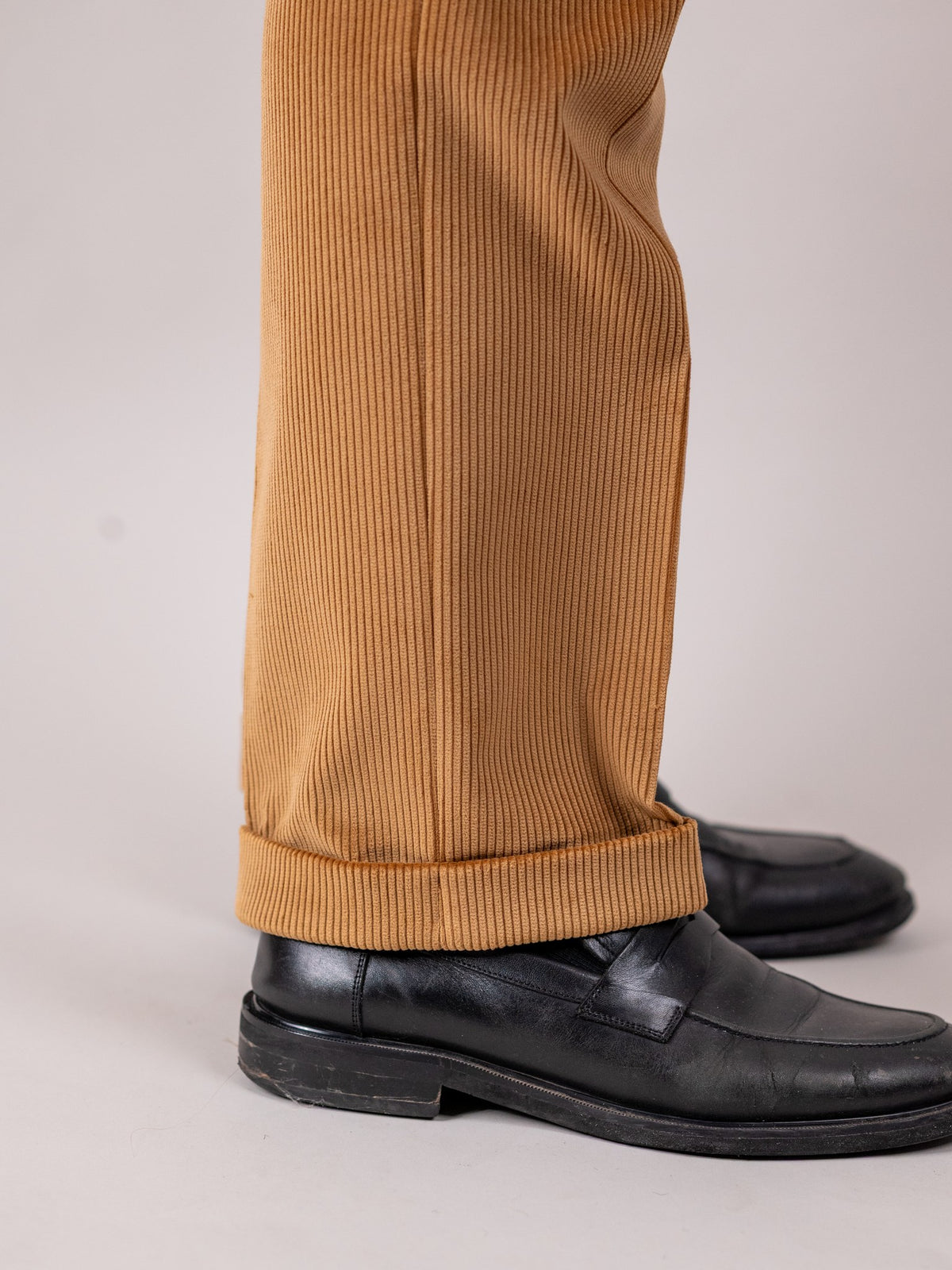 Brisbane Moss corduroy trousers in Fawn, sandy brown cotton, detail of the turn-ups — John Crocket