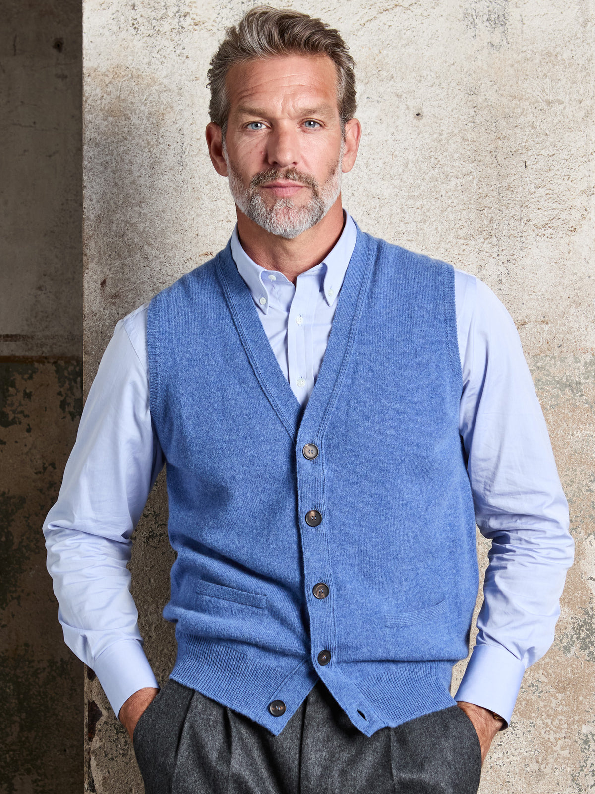 Lambswool sleeveless cardigan with button placket in Cloud, V-neck, worn, front view – John Crocket