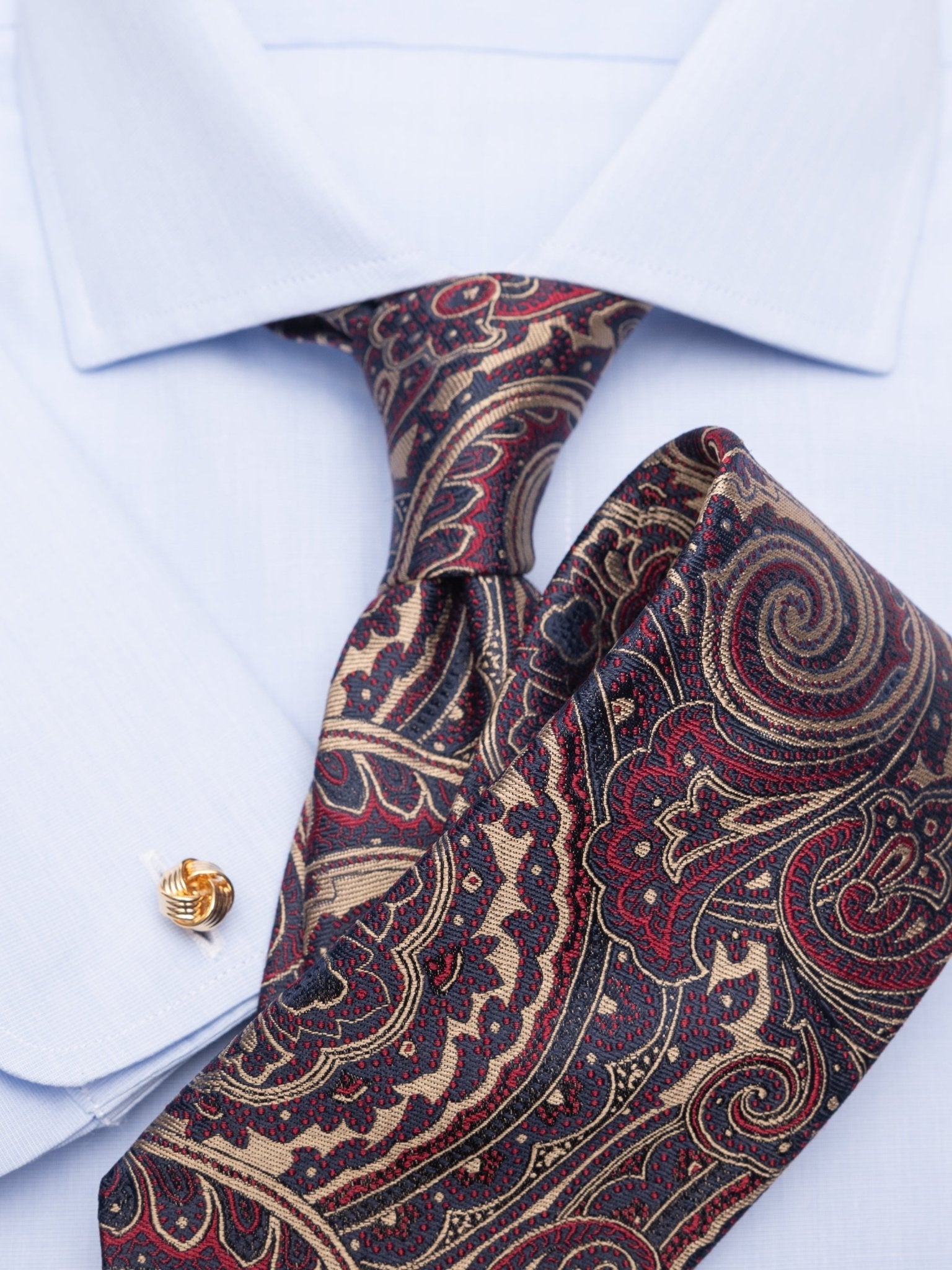 Tie with paisley in dark blue/gold