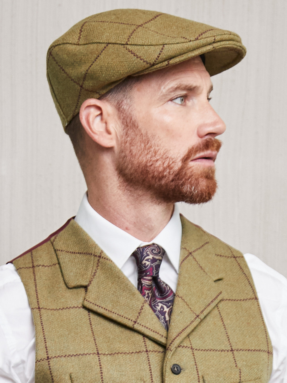 Casquette plate verte à carreaux en Lovat Tweed
