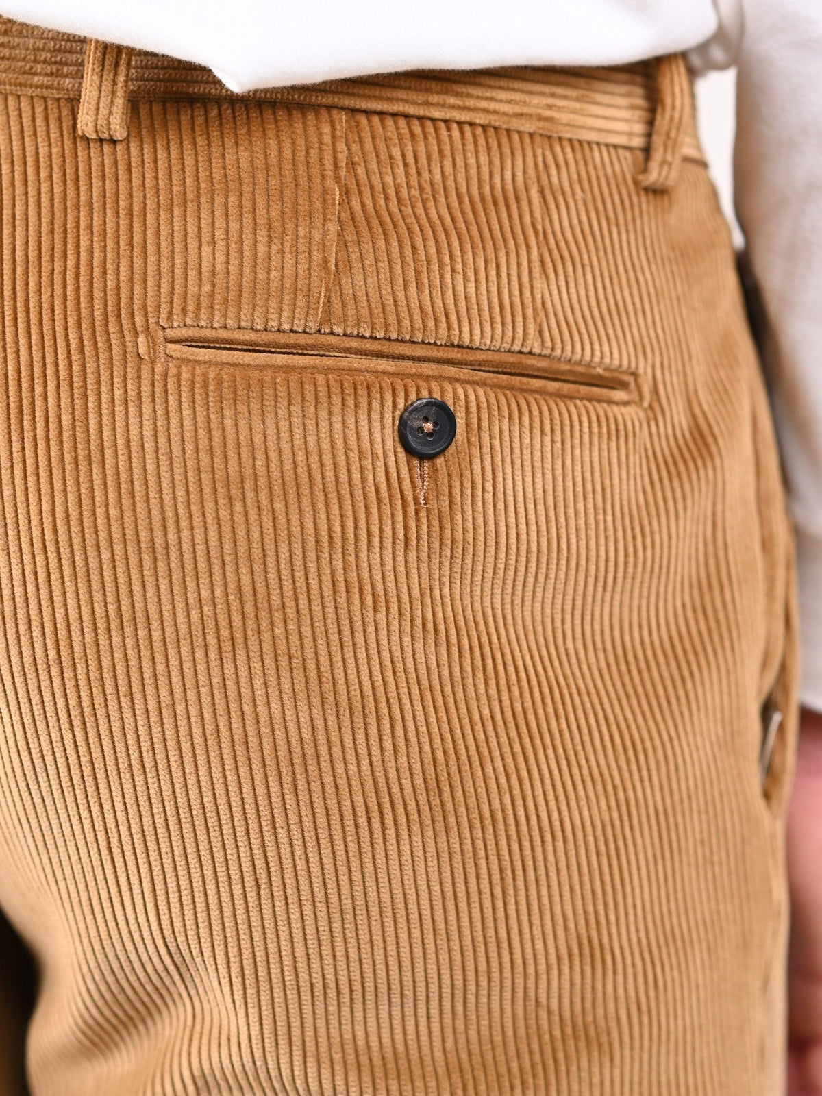 Brisbane Moss corduroy trousers in Fawn, sandy brown cotton, detail of the back pocket — John Crocket