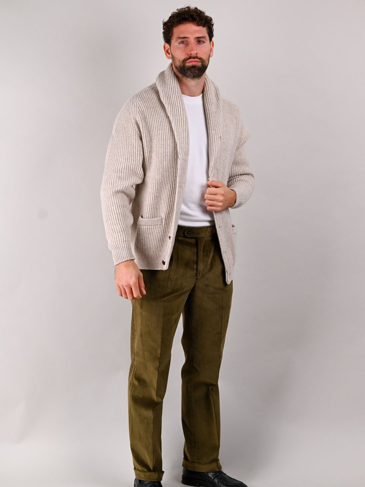 Brisbane Moss corduroy trousers in Drab, khaki cotton, worn by a model — John Crocket