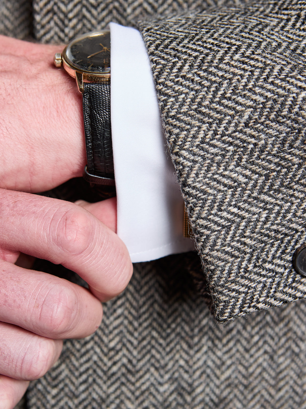 Dark Grey tweed suit in Moon Tweed, end of the sleeve with shirt cuff – John Crocket
