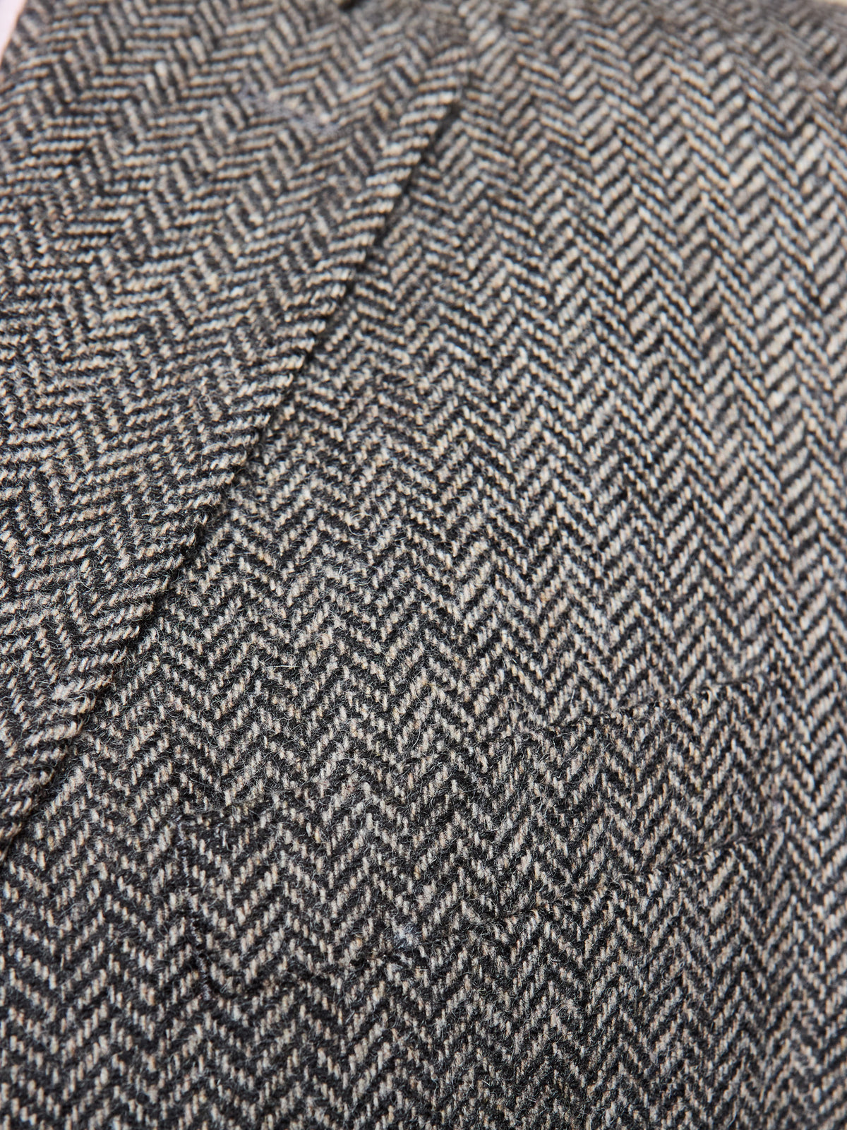 Dark Grey tweed suit in Moon Tweed, fabric detail with herringbone at the shoulder seam – John Crocket