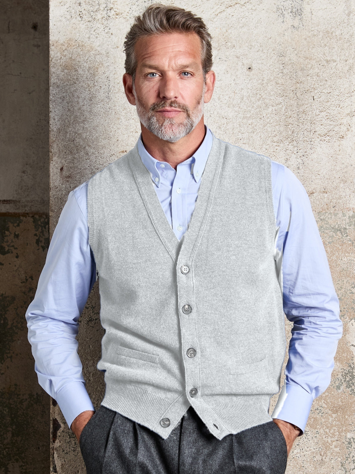 Lambswool sleeveless cardigan with button placket in Flannel, V-neck, worn, front view – John Crocket