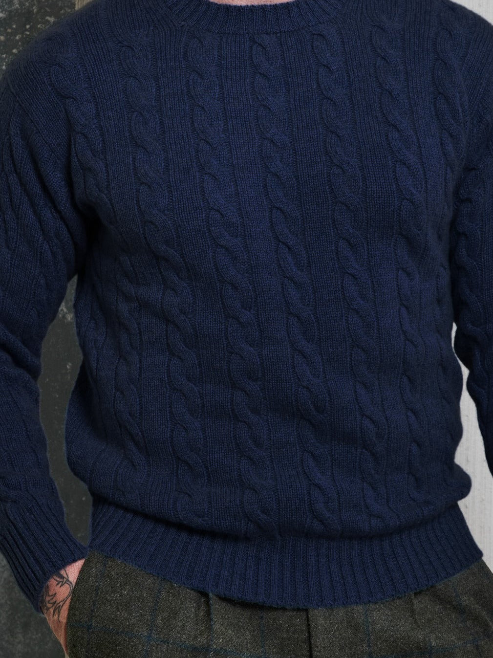 Cashmere cable-knit jumper (6-ply) in navy, worn, front view – John Crocket